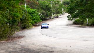 Scarred - blue car drifting on scenic winding road | Trending HD Video