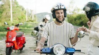 Woman Within - a man helping a woman sit on a moped | Trending HD Video