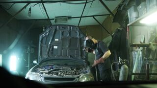 Electric car - man welding a car | Trending HD Video