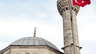 a mosque with a flag flying in the air | Professional HD Video