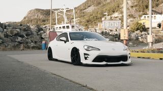 Cartier - sleek white sports car on mountain road | Trending HD Video