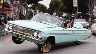 Cardigan - classic car parade with family in vintage convertible | Trending HD Video