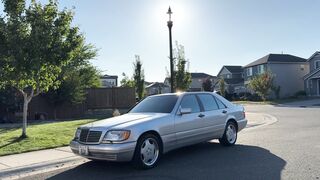 Electric car - elegant silver sedan parked in sunny suburb | Trending HD Video