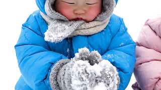 cute babies on snow garden