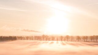 Olympic Winter Games Milano Cortina 2026 - serene winter sunrise over snowy landscape | Trendin