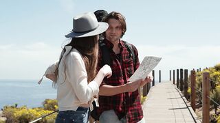 Travel Backpack - couple talking while holding a map | Trending HD Video