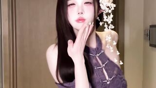 The purple-clad girl flirtatiously teases wildly