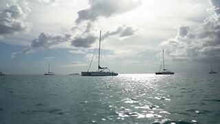 Relax. Sailing past sailing yachts during the regatta