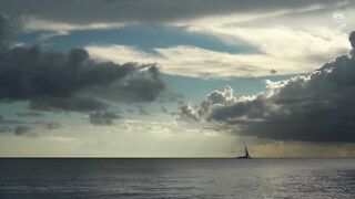 Sailboat sailing at sea sunset