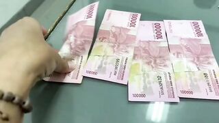 Contoh uang mutilasi