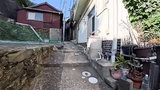 As I was walking down a narrow street in the fishing port town, a calico cat seemed to be trying to communicate with me.
