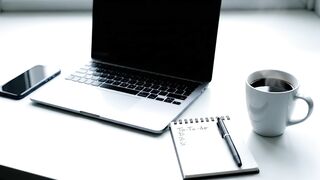 Minimalist Workspace with Laptop, Smartphone, Coffee, and To-Do List
