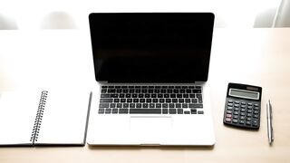 Minimalist Professional Workspace with Laptop and Office Supplies