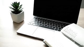 Minimalist Modern Workspace with Laptop and Notebook