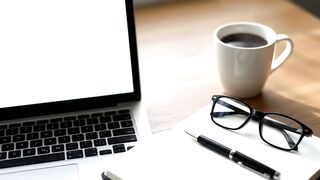 Minimalist Professional Desk Workspace with Laptop and Coffee