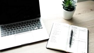 Modern Minimalist Workspace with Laptop and Planner
