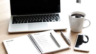 Productive Workspace with Laptop, Coffee, and To-Do List Checklist