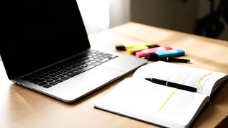 Modern Study Workspace with Laptop and Textbook