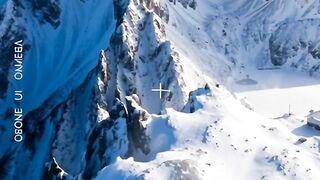 ​Majestic Alpine Peaks: An Epic Aerial Journey Above the Clouds