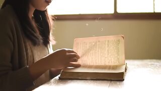 Woman Reading Vintage Book in Sunlight
