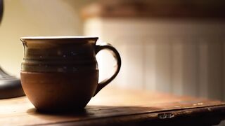 Steaming Ceramic Coffee Mug on Wooden Table