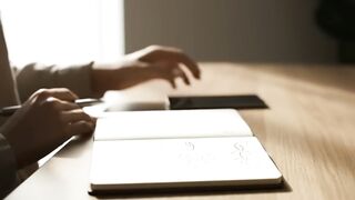 Hands of Person Browsing Smartphone App at Modern Desk