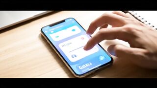 User Interacting with Financial Goal App on Smartphone