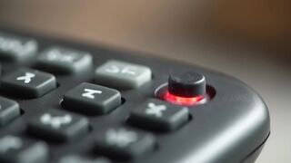 Red Illuminated Button on Electronic Device