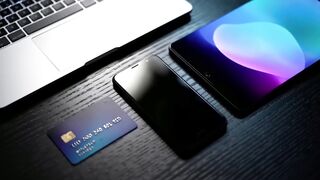 Modern Digital Workspace with Laptop, Smartphone, and Credit Card