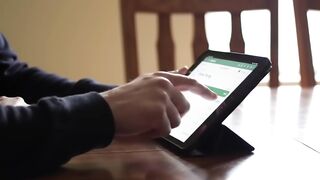 Person Using Digital Tablet for Work or Study