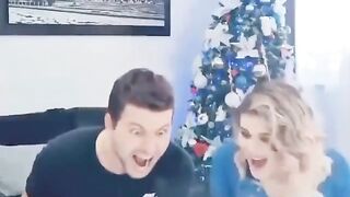 A couple playing in the Christmas area
