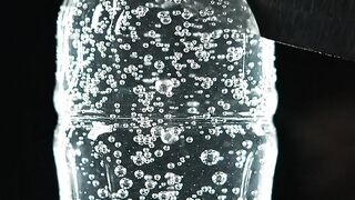 Soda Bottle Sliced By Blade
