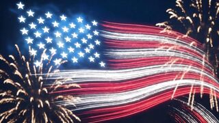 Glowing American flag design formed by vibrant light trails with golden fireworks exploding in background