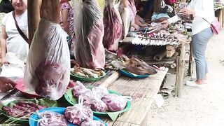 This is an indigenous and hilly market. You'll be surprised to see what kind of meat is available here.