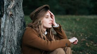 Sitting girl with a broken heart.