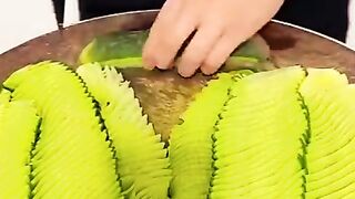 Vegetable cutting style He is a vegetable cutter.