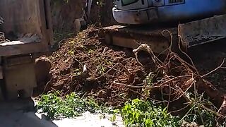 ROAD MAINTENANCE PROJECT EXCAVATOR CARRIES OUT ROAD REPAIRS FOR ROAD EXPANSION