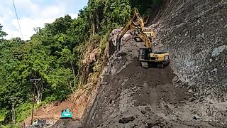 CAT 320D Excavator Breaker Conquering Cliffs for Cutting Hard Soil Layers in Road Widening Work