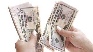 Woman counting dollars