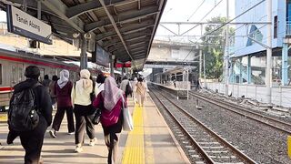 Commuters Walking on Railway Platform