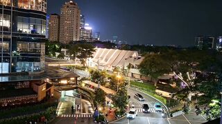 Night Cityscape with Illuminated Buildings and Streets