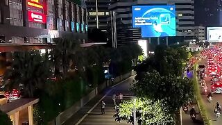 Busy City Traffic at Night with Skyscrapers.