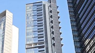 Modern Skyscraper Building Under Clear Blue Sky