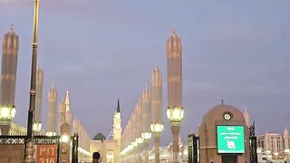 Mosque Courtyard with People at Dusk