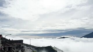 Mountain Above Clouds with Sunlight