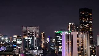 Night City Skyline with Illuminated Streets