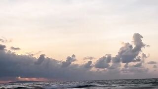 Ocean Waves at Sunset with Soft Clouds