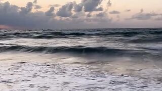 Sea Waves Under Cloudy Sky at Sunset