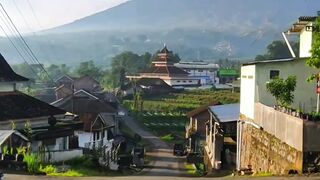 Quiet Village Road Leading to Mountain