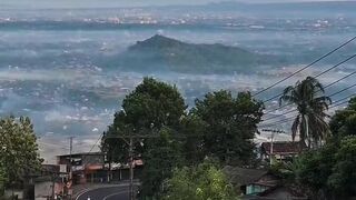 Scenic Mountain View Above Rural Village at Sunrise
